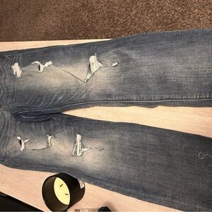 woman’s Distressed Blue Jeans